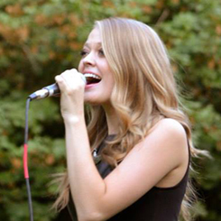 Candice Russell performing live.