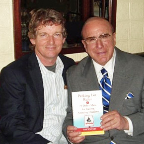 Tom Sturges with music legend Clive Davis (holding Sturges' first book, Parking Lot Rules & 75 Other Ideas for Raising Amazing Children). 
