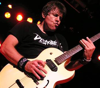 George Thorogood performing live.