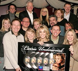 Iain Pirie with Carrie Underwood, and execs from her record label and management