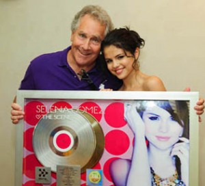Jon Lind with Selena Gomez, at her gold record award presentation.