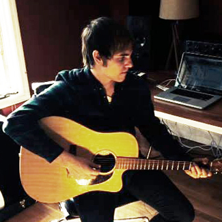 Ross Copperman, playing guitar.